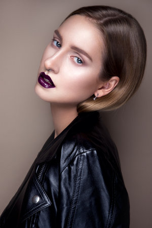 Portrait of gothic girl with blue eyes in dark clothes. Dark Lips.の写真素材