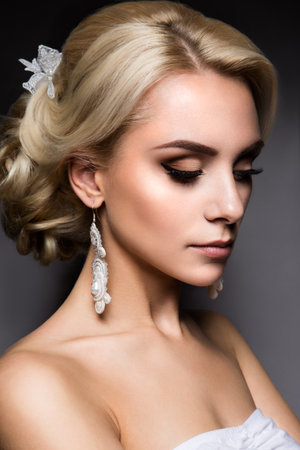 Close-up portrait of beautiful woman with bright make-up and hairstyle.の写真素材