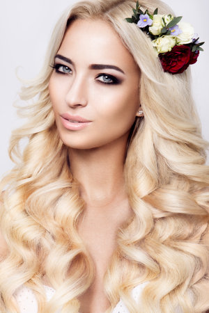Close-up portrait of beautiful woman with bright make-up and hairstyle.の写真素材