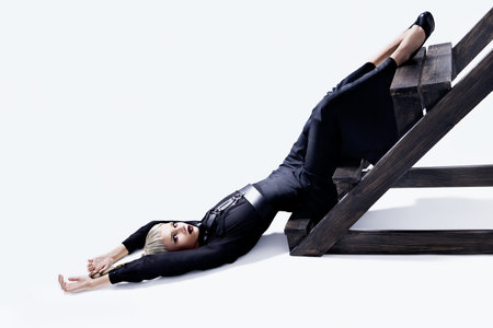 Beautiful girl lying upside down. Fashion lady.の写真素材