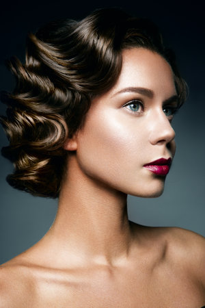 Retro Woman Portrait with beautyful hairstyle and make up.の写真素材