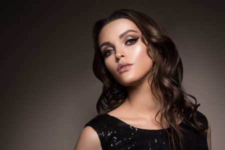 Beautiful young brunette with make-upの写真素材