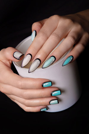 Female hands with pop art style manicure. Creative nail art.の写真素材