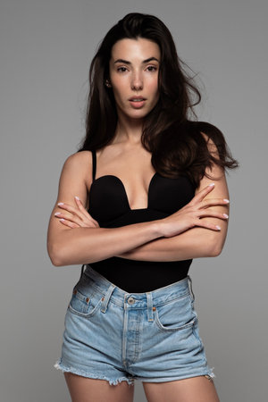 Beauty portrait of model with natural make-up. Fashion shiny highlighter on skin, sexy gloss lips make-upの写真素材