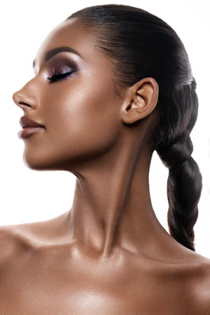 An Elegant and Glamorous Profile Portrait Featuring Radiant Sparkling Skin and Sleek Hairの写真素材