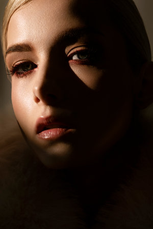 Closeup image of a woman in a luxurious fur coatの写真素材