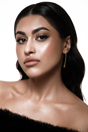 A captivating and stunning fashion portrait that showcases an elegant woman with flawless makeup and soft wavy hairの写真素材