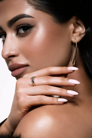 A captivating and stunning fashion portrait that showcases an elegant woman with flawless makeup and soft wavy hairの写真素材