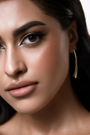 A captivating and stunning fashion portrait that showcases an elegant woman with flawless makeup and soft wavy hairの写真素材