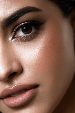 A captivating and stunning fashion portrait that showcases an elegant woman with flawless makeup and soft wavy hairの写真素材