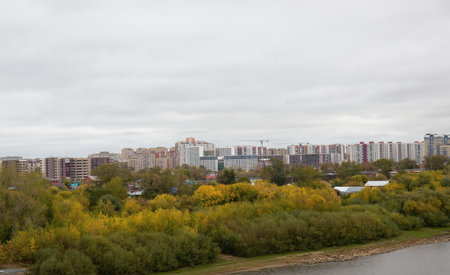 View of the other bank of the Tura River from the granite embankment of the city of Tyumenの写真素材