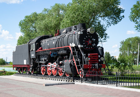 Old steam locomotive in the park. Russia, St. Petersburg