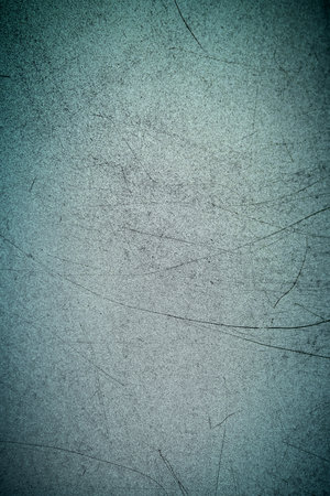 Texture of metal with long black scratches on the surface. Blue or green or turquoise and gray...