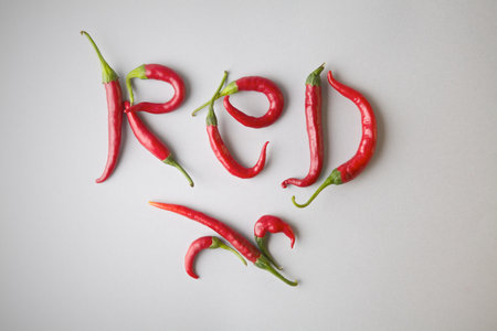 Word Red shaped with red chilli pepperの写真素材