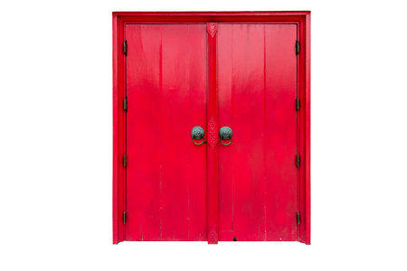 Red door isolated on white backgroundの写真素材