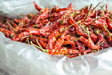 Dried red hot chillies in plastic bagの写真素材