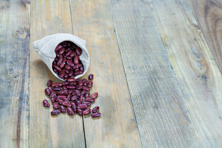 Kidney Beans on vintage wooden boards still life