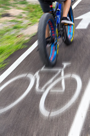 Bicycle lane sign on the road with blurred technique