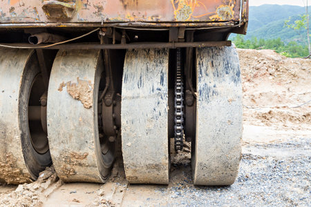 Wheels of road roller isolated on white background