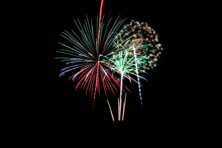 Colorful fireworks of various colors on black backgroundの写真素材
