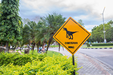 Yellow traffic label with dinosaur pictogramの写真素材