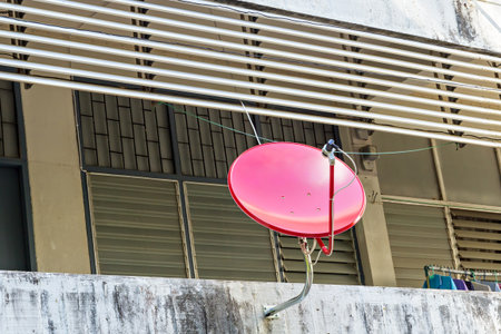 Satellite dish antenna on the wallの写真素材