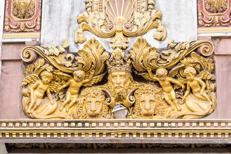 The king, angels and lions golden ancient sculptureの写真素材