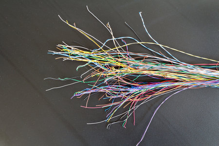 Multi color electrical wires on gray board