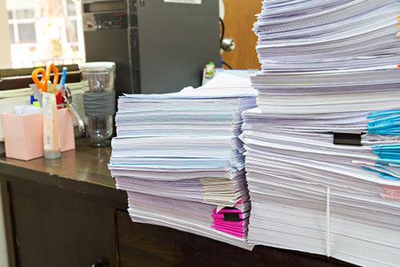 Stack of Documents and computer on the office deskの写真素材