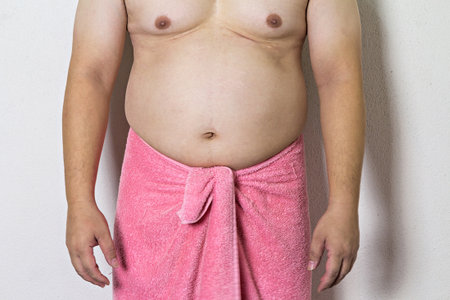 Body part of asian fat man with a big bellyの写真素材