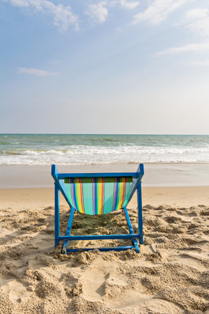 Beach chair on the beach and sea backgroundの写真素材