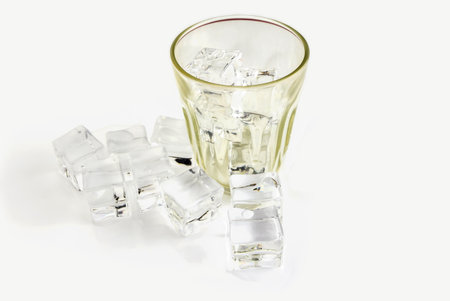 Ice cubes and glass isolated on white background