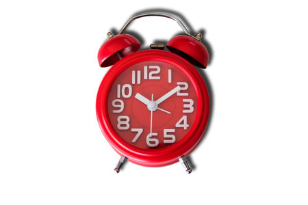 Old style red alarm clock isolated on whiteの写真素材