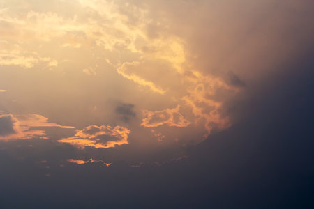 Dark clouds in orange at evening