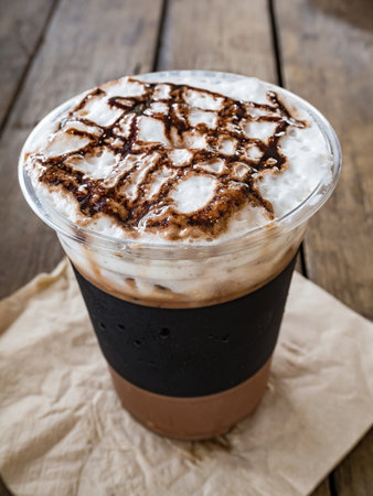 Ice coffee on a wooden table