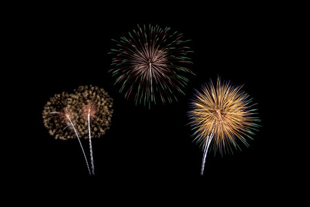 Fireworks of various colors isolated on black backgroundの写真素材