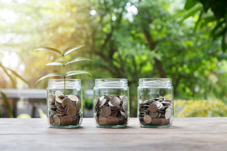 Mix coins and seed in clear bottle, Business investment growth conceptの写真素材