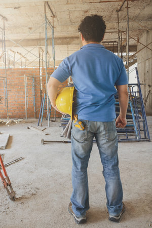 Construction Worker with helmet in building construction siteの写真素材