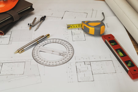 Blue print and measurement tool on architect's desk, architectural conceptの写真素材