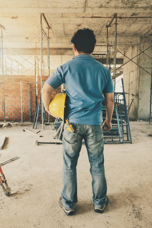 Construction Worker with helmet in building construction site