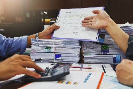 Business team meeting and discussing project plan. Businessmen discussing together in meeting room. Professional investor working with business project together. Finance managers task.の写真素材