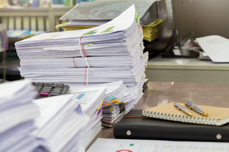 Close up of business documents stack on desk , report papers stack