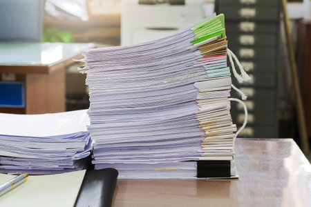 Close up of business documents stack on desk , report papers stackの写真素材