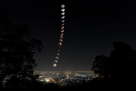 Lunar eclipse and trails phase over Chiang Mai city. Blood Moon in the lunar eclipse and also a Blue Moon and super moon called Super Blue Blood Moonの写真素材