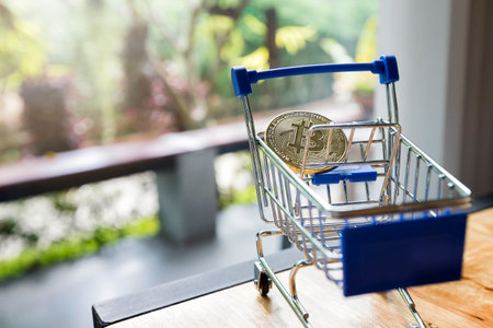 Finance and money concept. Bitcoin in mini shopping cart on blurry background