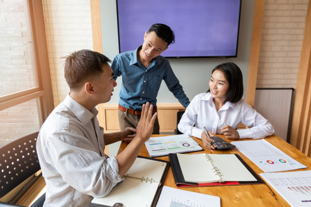 Business team meeting and discussing project plan. Businessmen discussing together in meeting room. Professional investor working with business project together. Finance managers task.の写真素材