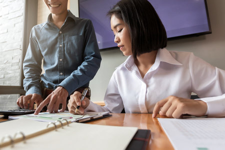 Business team meeting and discussing project plan. Businessmen discussing together in meeting room. Professional investor working with business project together. Finance managers task.の写真素材