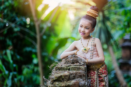 Cute Thai girl wearing thai traditional clothing.の写真素材