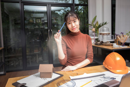 Female architect working with new startup project at home office.