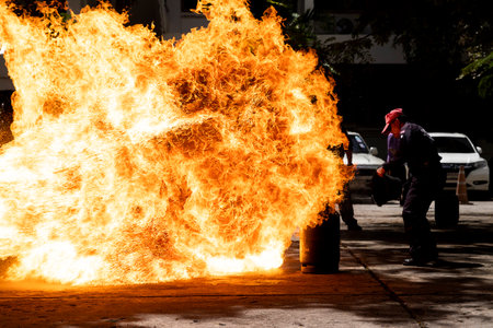 Chiang Mai, Thailand - August 19, 2018: Firefighter demonstrates the explosion of household gas cylinders.のeditorial素材